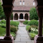 The covered arcades of the Cuxa Cloister surround a garth, or enclosed yard, open to the sky.